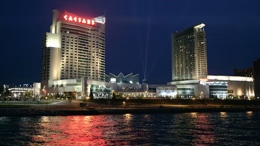 Caesars Windsor tower on the Detroit River waterfront lit up after dark
