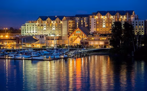 River Rock Casino Resort and its yacht marina reflecting on the Fraser River at dusk